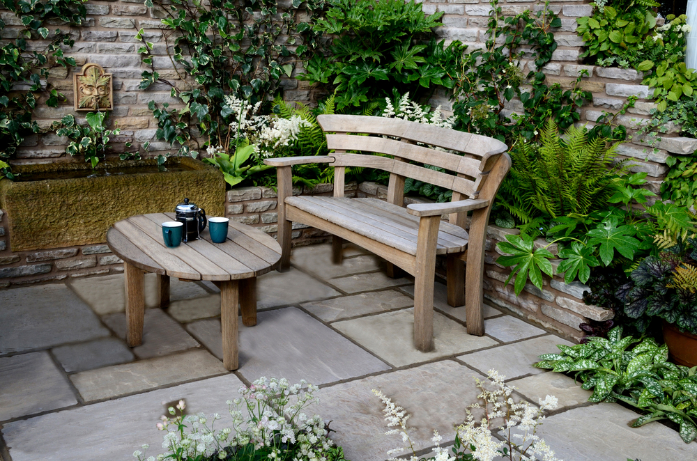 Small Garden Patios- a picturesque chair and table with accompanying.